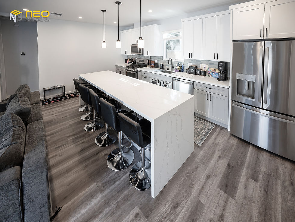 Open-concept living room and kitchen inside a 2-bedroom Chatsworth ADU designed for multi-generational housing.