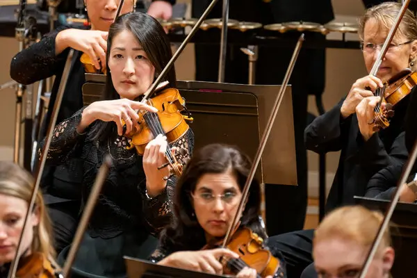 The performer playing the violin