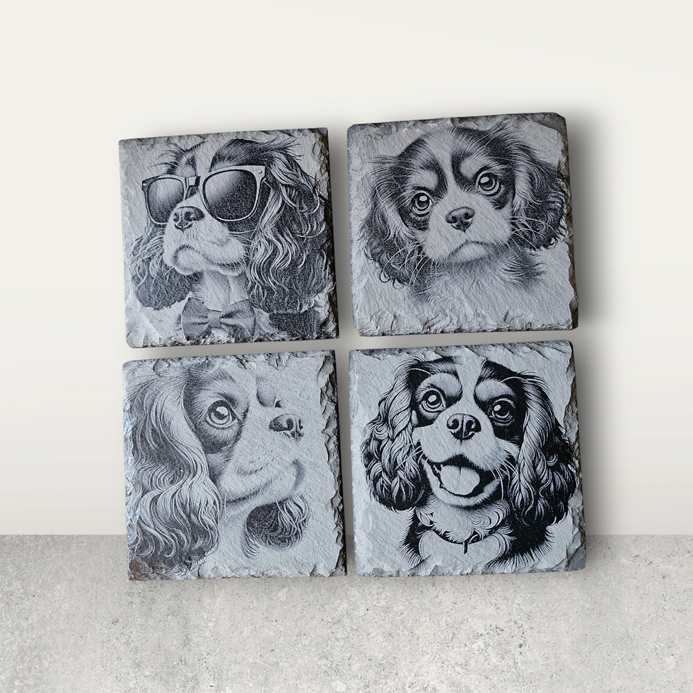 Collage display of the four King Charles cavalier spaniel dog designs on slate coasters.