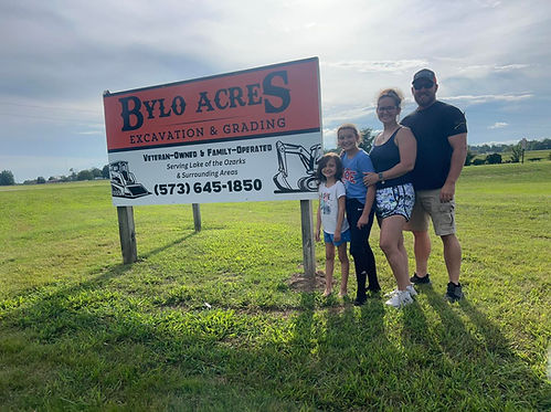 Bylo Family in front of Eldon Sign.