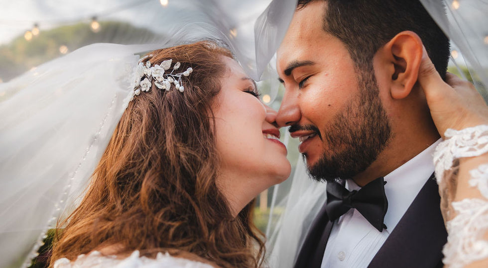 Bride and groom kissing romantically