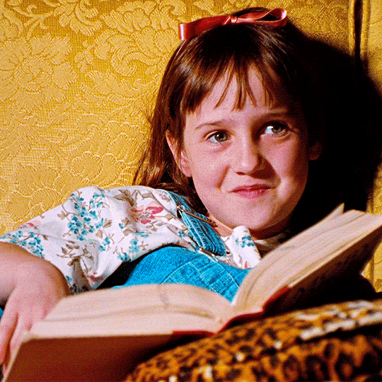 Matilda reading a book.
