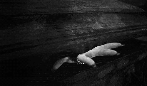 Vampire hand coming out of coffin.