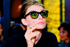 Audrey Hepburn in Breakfast at Tiffany's looking surprised.