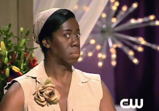 Miss J from America's Next Top Model looking straight into the camera with a scared expression.