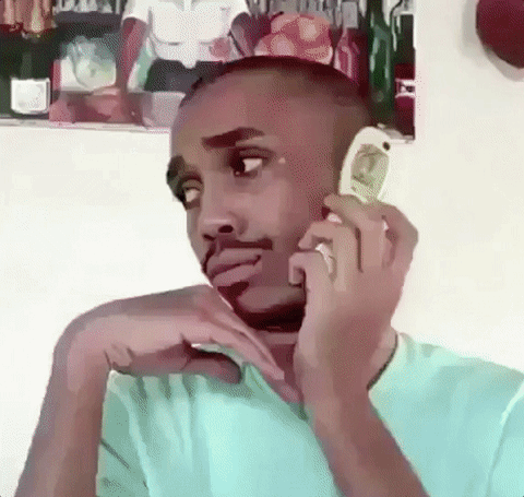 Man sassily closing a flip phone.