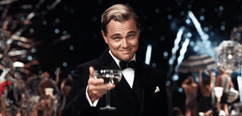 Jay Gatsby raising champagne glass