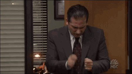 Michael Scott giving a drum roll.