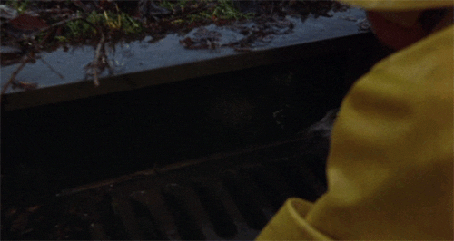 Tim Curry's Pennywise popping out of the sewer.