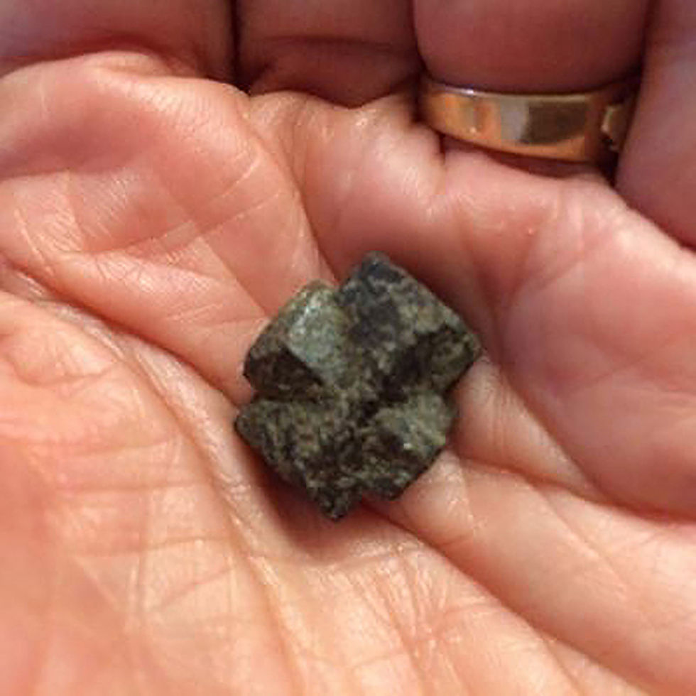 Maltese cross rocks like this one are the most prized ones for collectors to find. This was found at Blanchard Dam. Photo by Bill Vossler