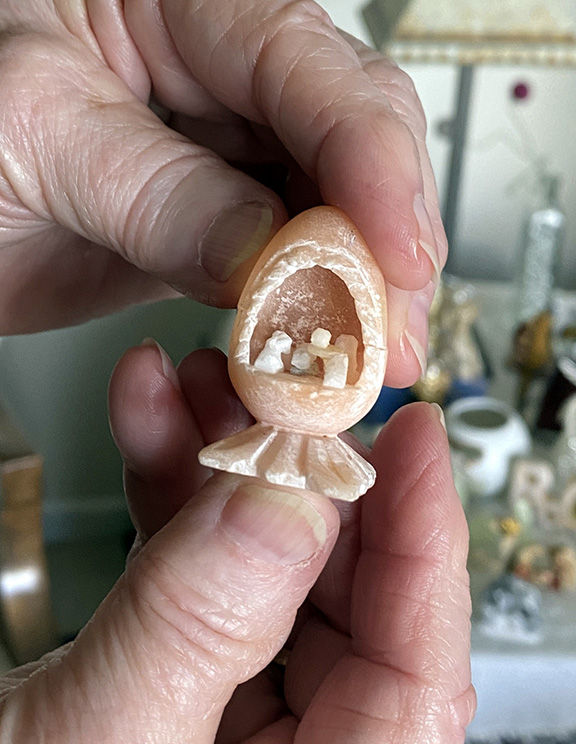 The tiniest nativity set Cathy Johnson has is about the size of a thimble. Photo by Julie Parent