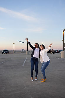 Travel Advisors posing in front of a plane