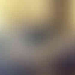 Three people stand smiling behind a booth labeled "Global Career Center" with brochures and displays. A banner for Cigna is in the background.