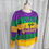 Thumbnail: Sequin sweater in purple, green, and gold colors with "Let's go queens" text.