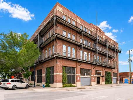 Open-concept loft with white oak floors and updated kitchen at Herrin Lofts Unit 315, 2205 McKinney Street, EaDo Houston TX