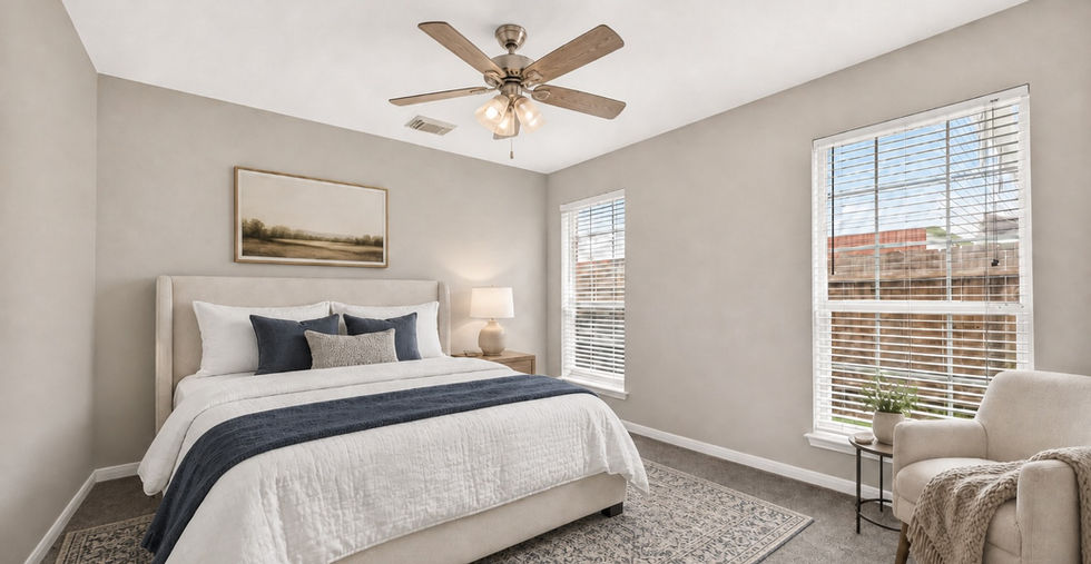 Secondary bedroom with ceiling fan and double windows at 835 Stevens Creek Lane in a gated Richmond TX home.