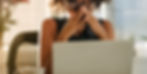 A woman in front of her laptop experiencing stress