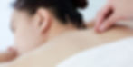 A woman receiving acupuncture for allergies