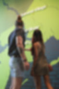 Engaging educational experience at Creekside RnR, New Brunswick, with visitors exploring a large projected map