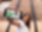 young-beautiful-girl-holding-a-black-iphone-6-in-portrait-position-while-at-the-city-mocku