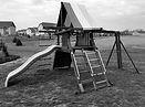 A swing set about to be demolished and hauled away.