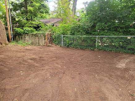 A clean, wide-open backyard in Indianapolis after Schott Services demolished a wooden mini barn and hauled away all debris.