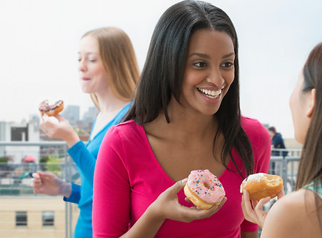 Women Eating Donut