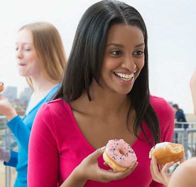 Women Eating Donut
