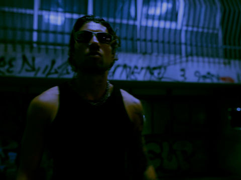 Paolo Ferrara in front of the camera in a medium shot during the filming of the music video produced and directed by Acid Thermal