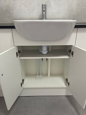 Photo of bathroom sink piping installation - L Reeve Plumbing