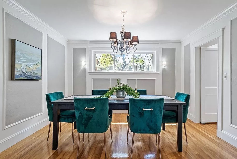 a dining room with a table and chairs and a chandelier