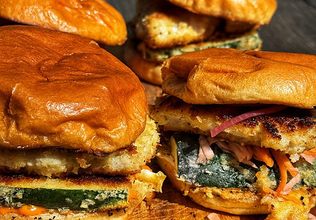 Spicy Pollock Burger with Crispy Zucchini and Pickled Carrot & Onion