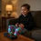 Thumbnail: image showing a child relaxing playing video games wearing the Kids Colourful Neon Stars & Hearts Lounge Pants