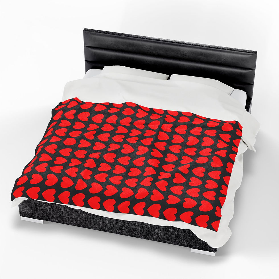image of the red heart blanket on black base on a king size bed