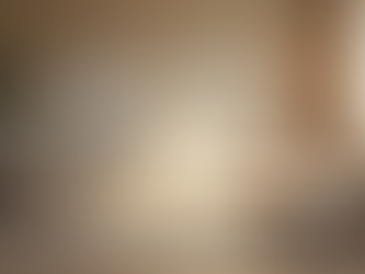 Eye-level view of a living room corner with soft cushions and warm lighting