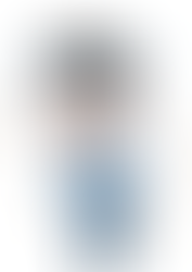 boy shivering with cold and snow flakes falling in the background