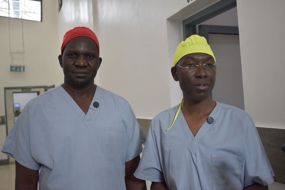 Dr. Okello Joseph Damoi and Wilberforce M. Kabweru, leading surgical experts, collaborate in the corridors of advanced medical care.