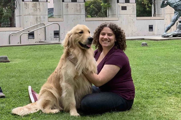 Bethan with dog outside.