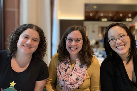 Bethan,Kelsey and Jenny posing for a photo during dinner.