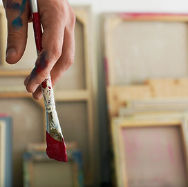 Holding a Paintbrush