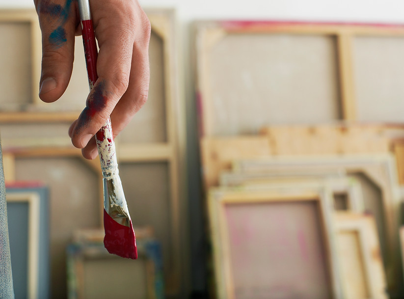 Holding a Paintbrush