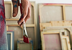 Holding a Paintbrush
