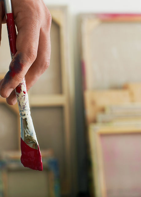 Holding a Paintbrush