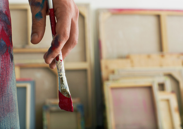 Holding a Paintbrush