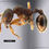 Thumbnail: Close-up macro image of Stenamma brevicorne queen ant, showcasing detailed features and distinctive dark coloration.