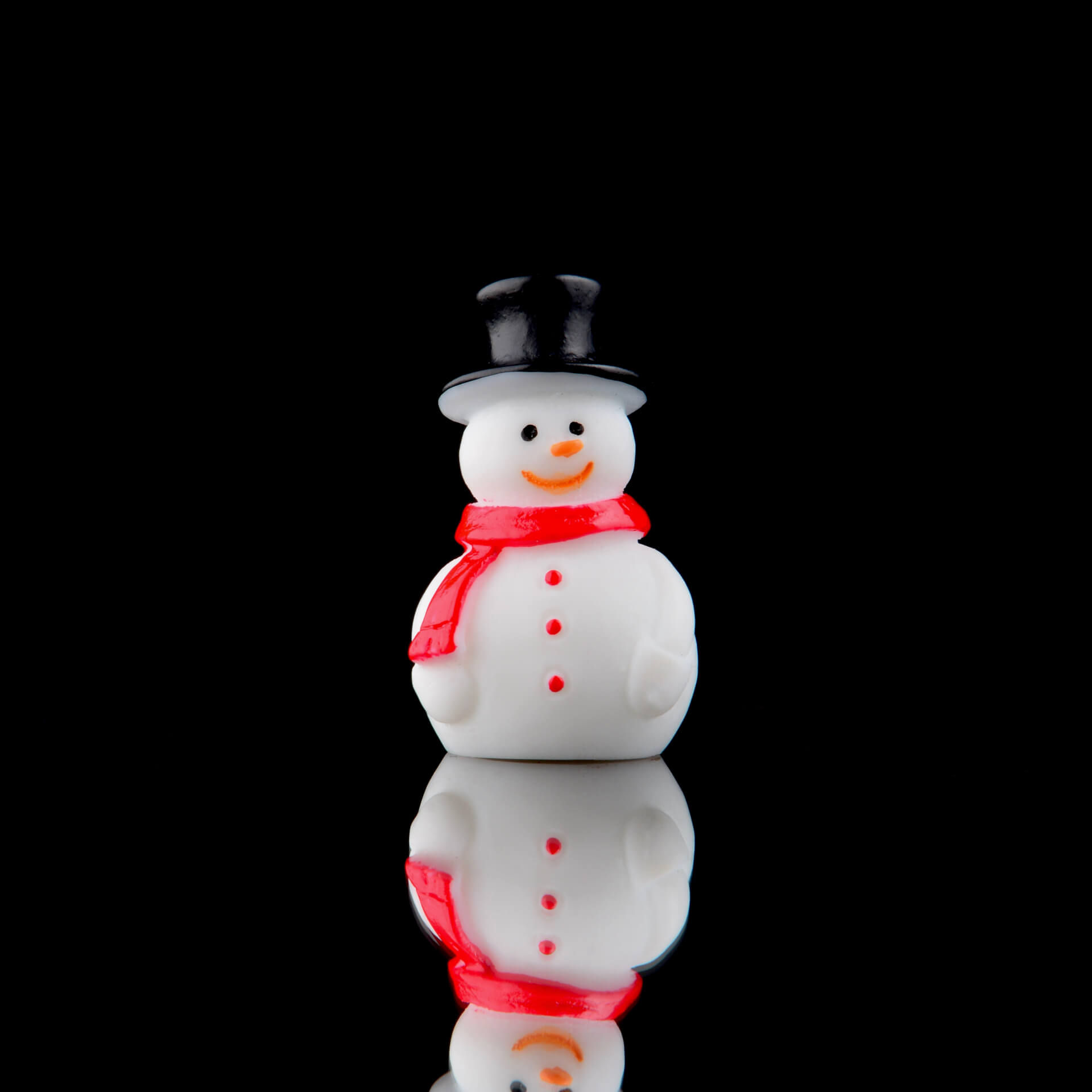 Mini snowman holiday decoration with black hat and red scarf, perfect for festive spider enclosures