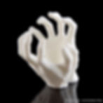 A gothic-themed spider enclosure magnetic decoration, with a hand in a partially closed position.