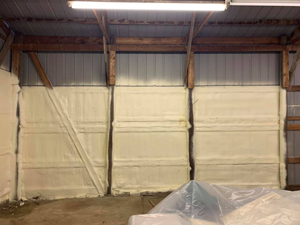 Agricultural building insulated to protect equipment and maintain stable temperatures