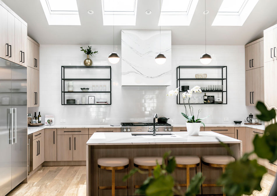 modern kitchen skylights open metal shelves light wood cabinets black hardware marble vent hood modern whimsy interiors edmond oklahoma