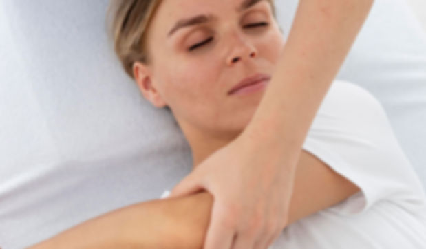 physiotherapist-helping-young-female-patient.jpg